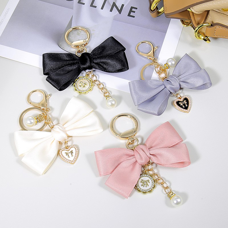 Phone Accessories Wholesale In China - จี้สตรีแฟชั่นโบว์โบว์พวงกุญแจเคสโทรศัพท์อุปกรณ์เสริมจี้มุกรูปหัวใจกระเป๋าจี้น่ารัก Kawaii สําหรับหญิง